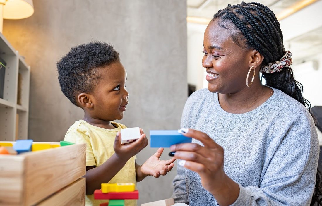An educator working one-on-one with a young child